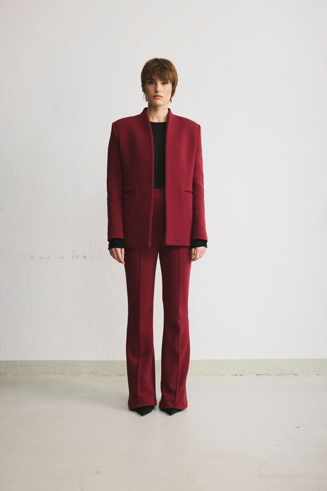 Burgundy thick-cotton flared trousers with topstitched pressed creases. - Image 6